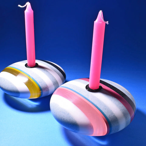 Disk shaped candle holders by Graham Lester